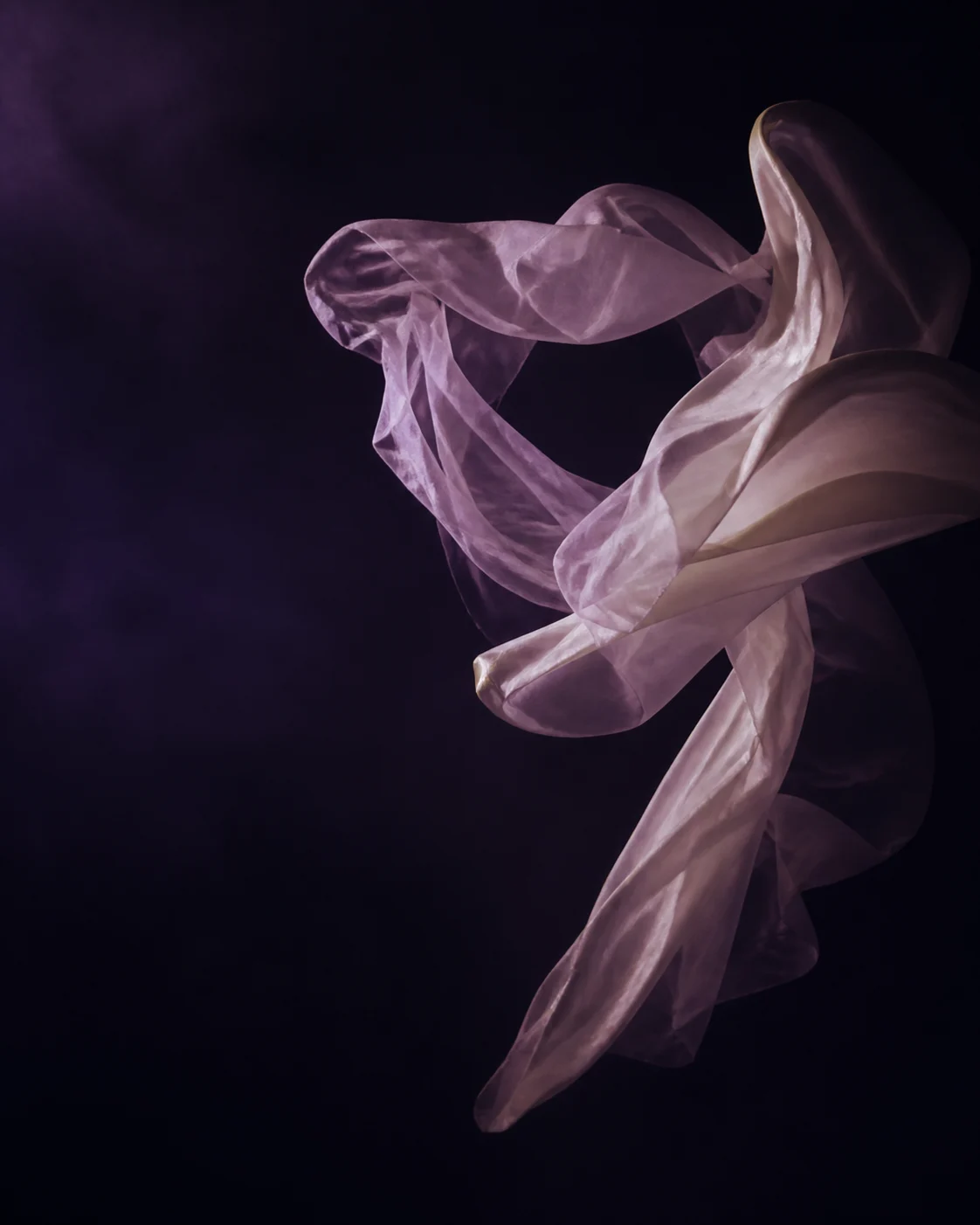 Translucent fabric suspended in a dark studio